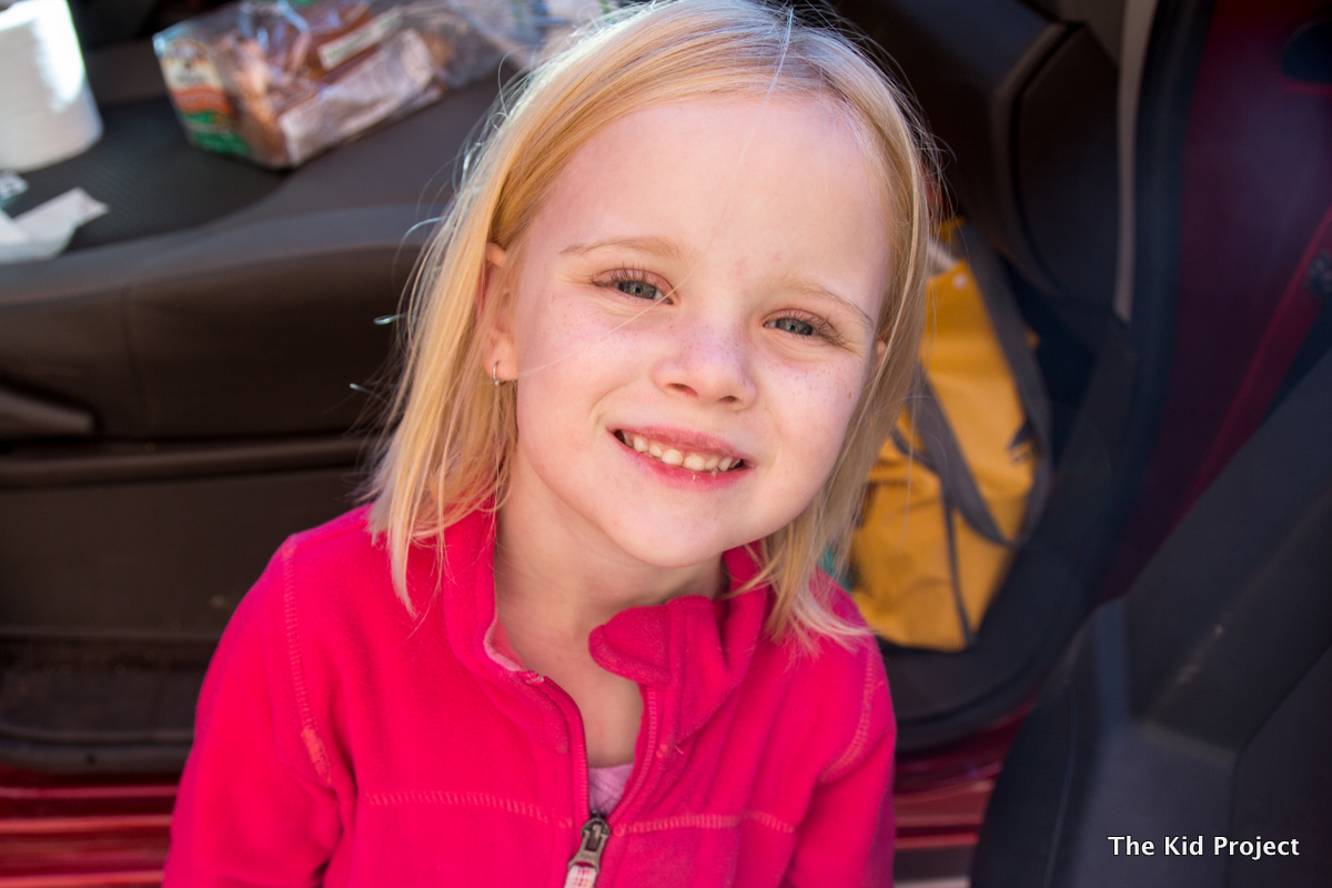 Girl, by car in Moab