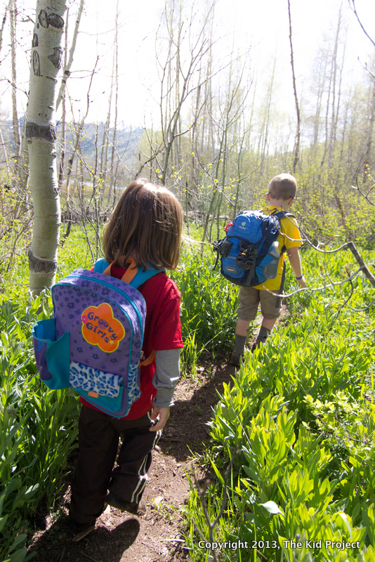 Kids hiking with backpacks