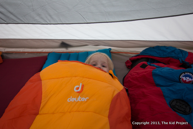 Girl in Deuter Sleeping Bag, in tent