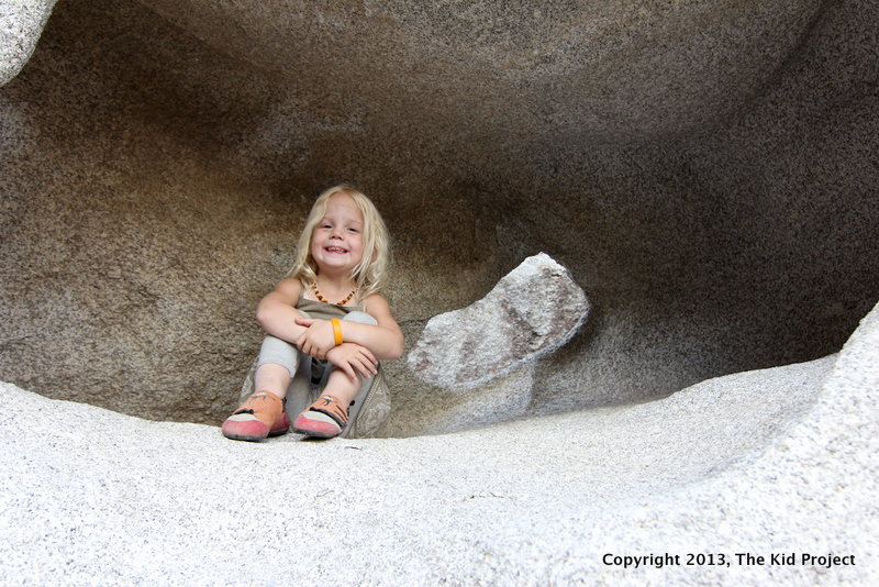 Girl in rock cave