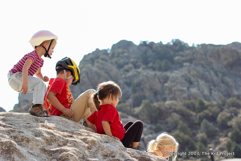 Kids scrambling on rocks