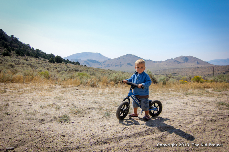 boy on strider at the crag