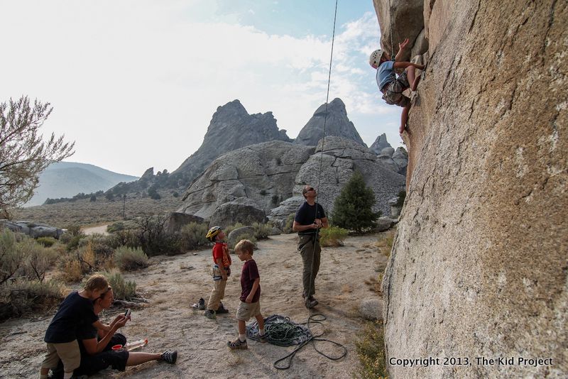 boy barefoot climbing