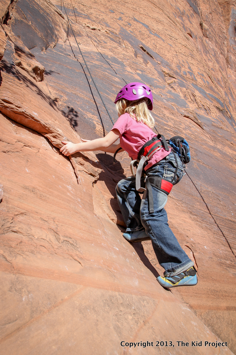 girl climbing Seibernetics, Potash Road, Moab
