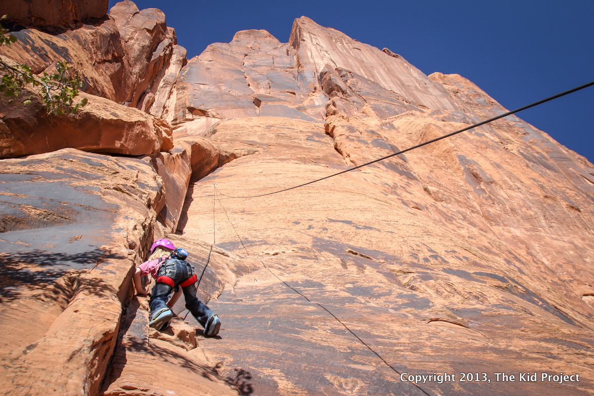girl climbing on Potash Road, Southern Utah