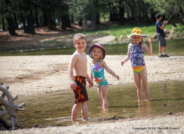 Siblings playing on the beach