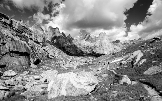 Climb ers trail into the upper Cirque of the Towers