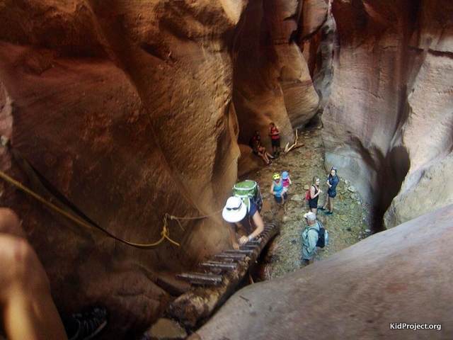 Ascending the ladder at the first water fall, Kanarra Creek Canyon, UT