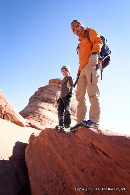 Kids standing strong, hiking with Dad