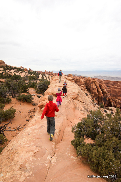 Hiking a sandstone ridge to Double O Arch