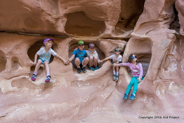 kids hiking in sandstone