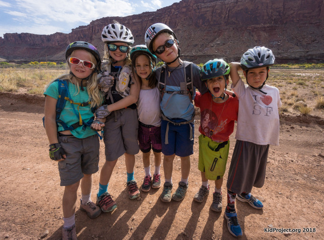 kids biking White Rim Trail