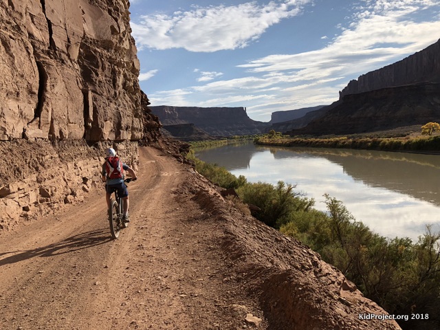 Kid mountain biking, moab, utah